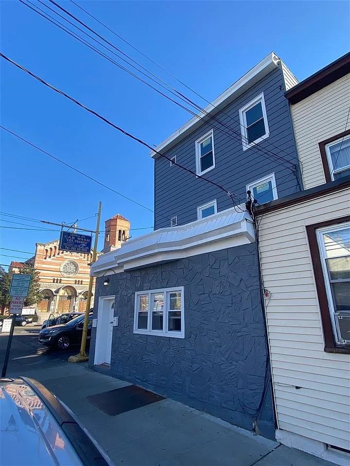 a view of a car parked in front of a house