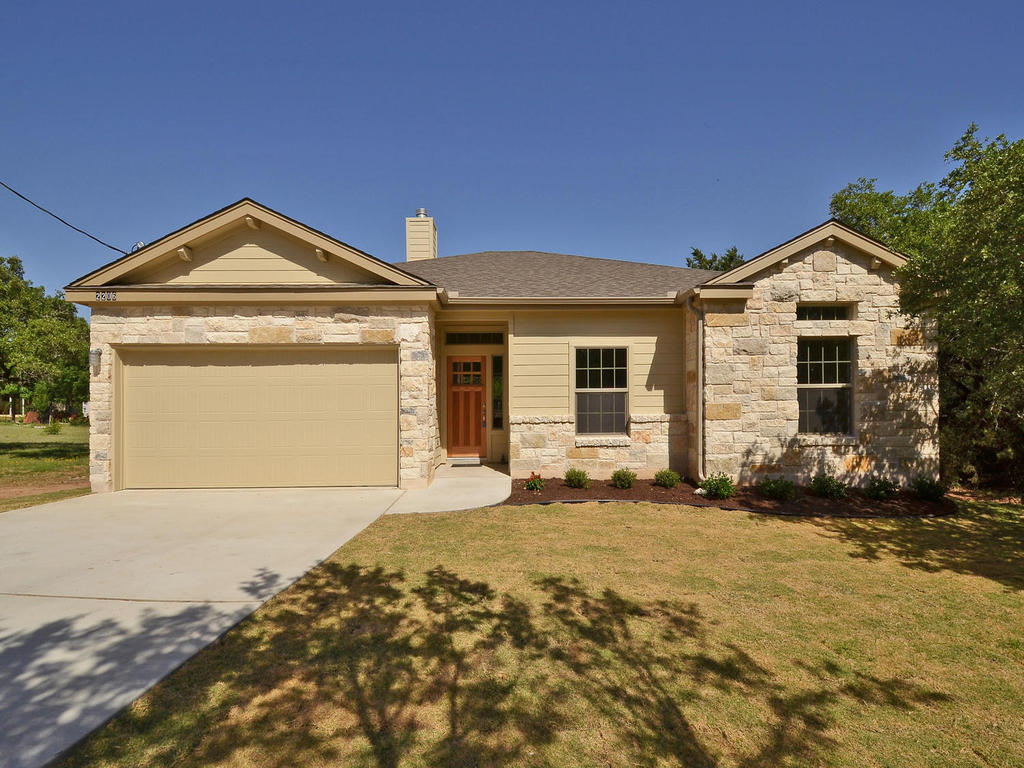 2206 Red Fox Road Austin, TX 78734 - Photo 1 of 1 a front view of a house with a yard