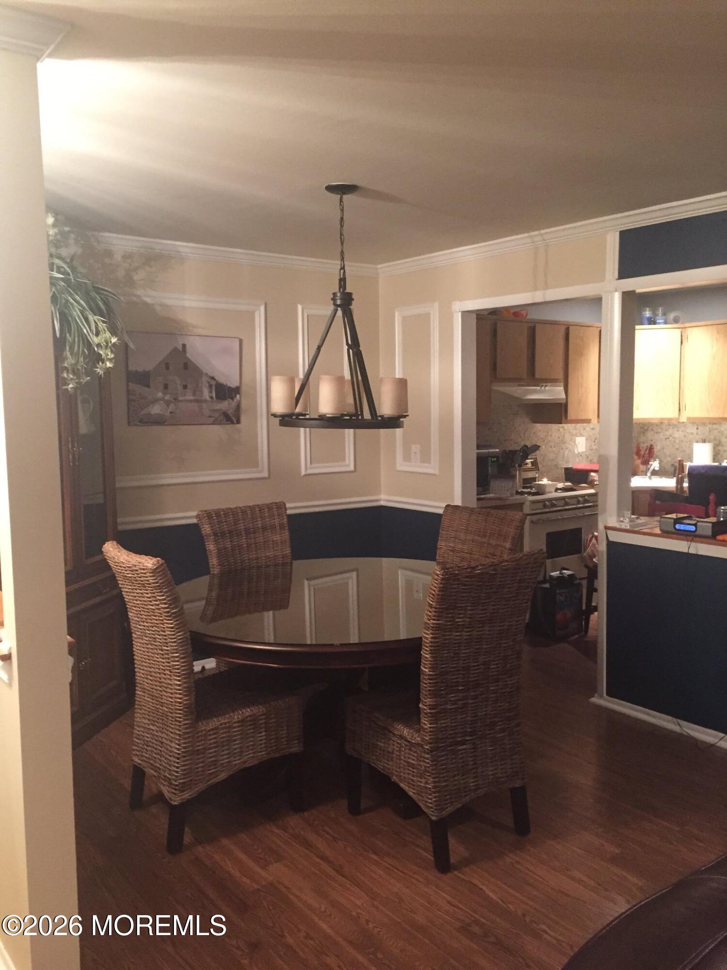 505 Harding Road, Unit 4 Freehold, NJ 07728 - Photo 6 of 9 a living room with furniture and a wooden floor