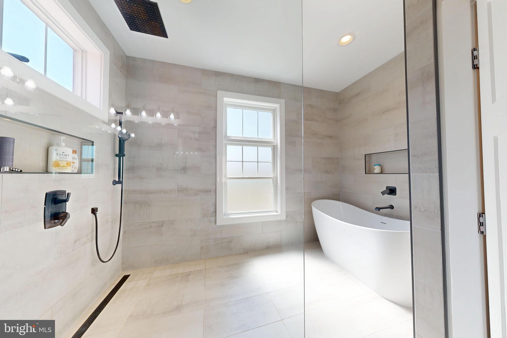 23730 Henry Road Ridgely, MD 21660 - Photo 18 of 28 a bathroom with a bathtub a toilet and a shower