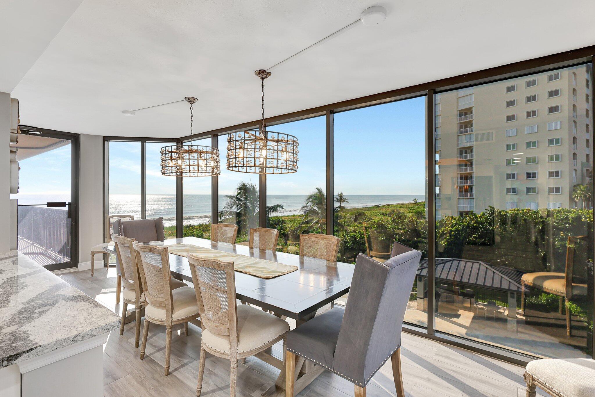 4000 North Hwy A1A, Unit 402 Hutchinson Island, FL 34949 - Photo 12 of 60 a view of a dining room with furniture window and outside view