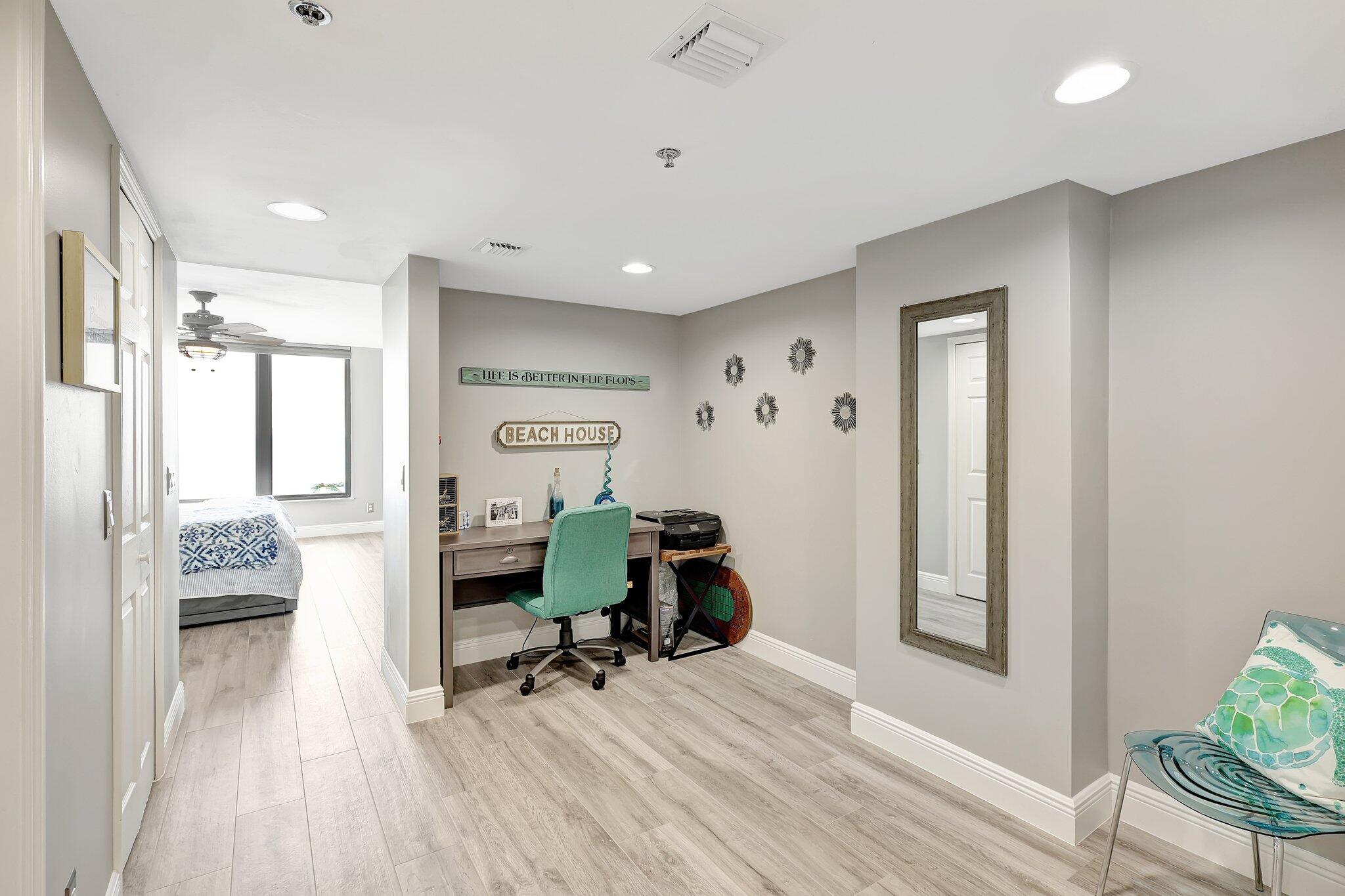 4000 North Hwy A1A, Unit 402 Hutchinson Island, FL 34949 - Photo 27 of 60 a view of a livingroom with furniture and a workspace