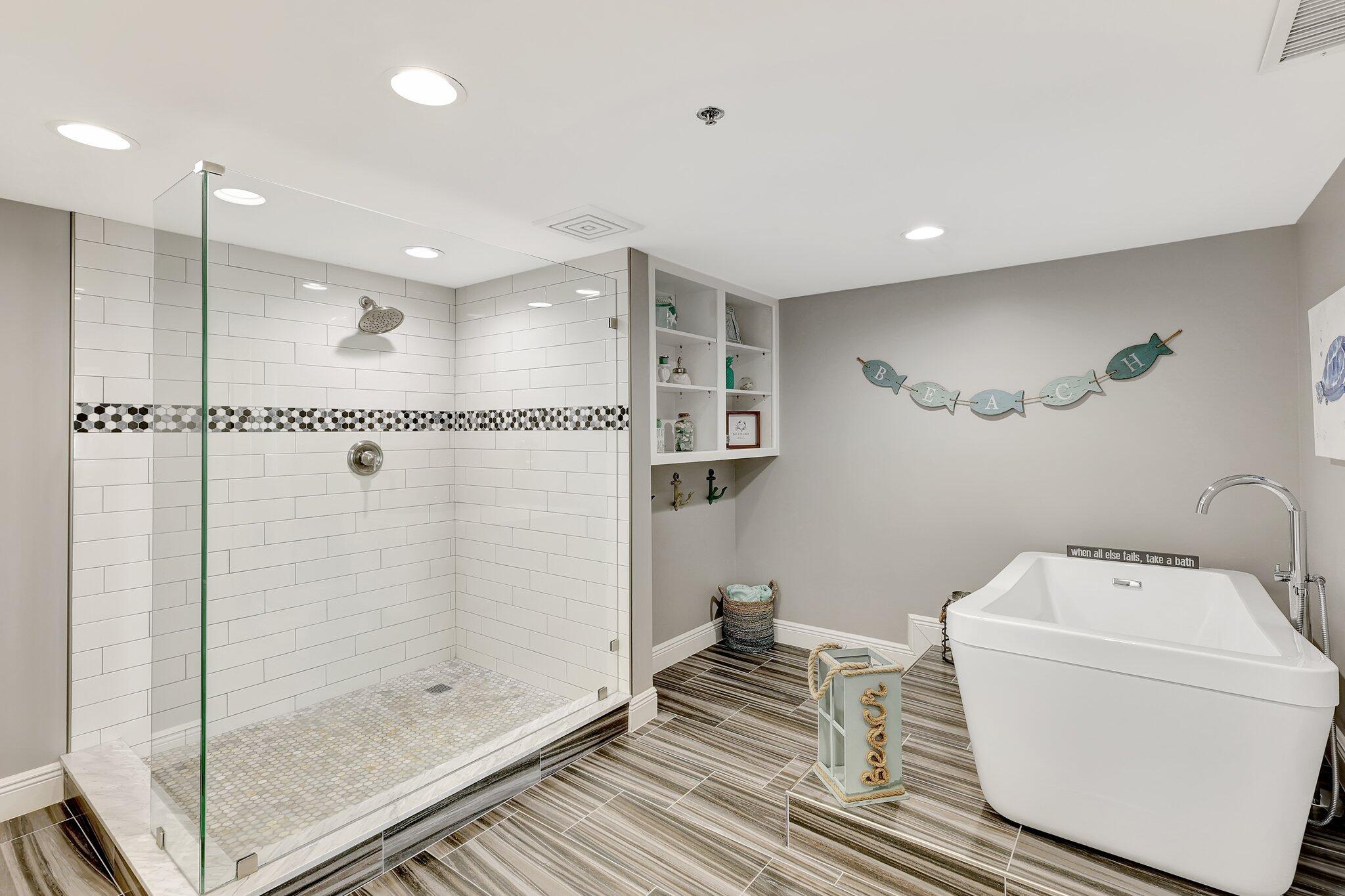 4000 North Hwy A1A, Unit 402 Hutchinson Island, FL 34949 - Photo 31 of 60 a bathroom with a shower a toilet and sink