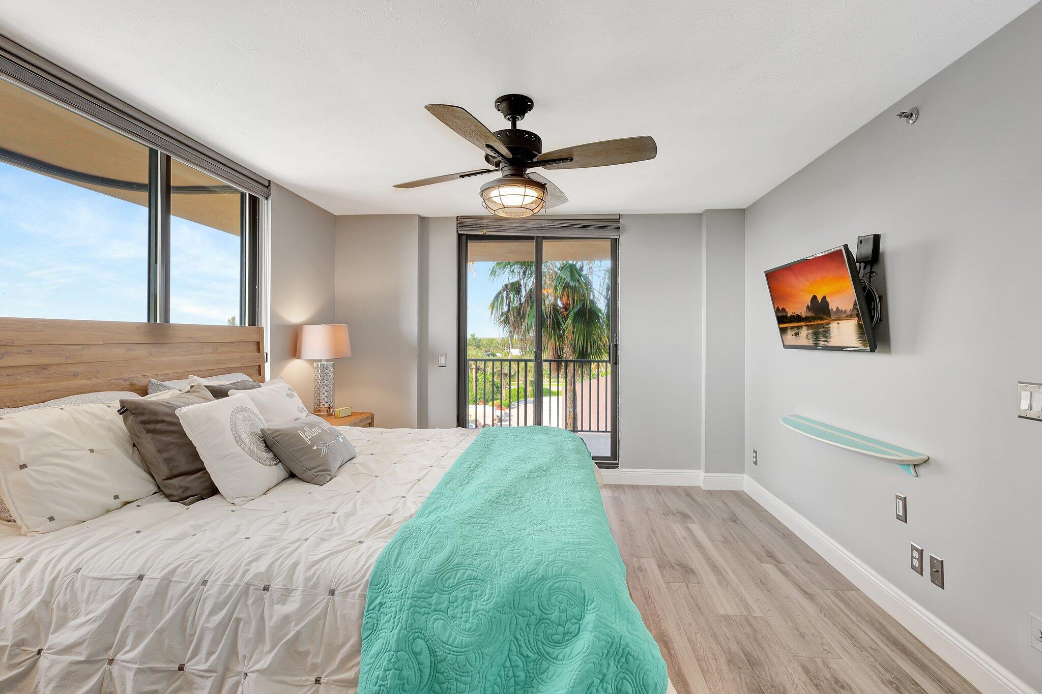 4000 North Hwy A1A, Unit 402 Hutchinson Island, FL 34949 - Photo 36 of 60 a bedroom with a bed and a window