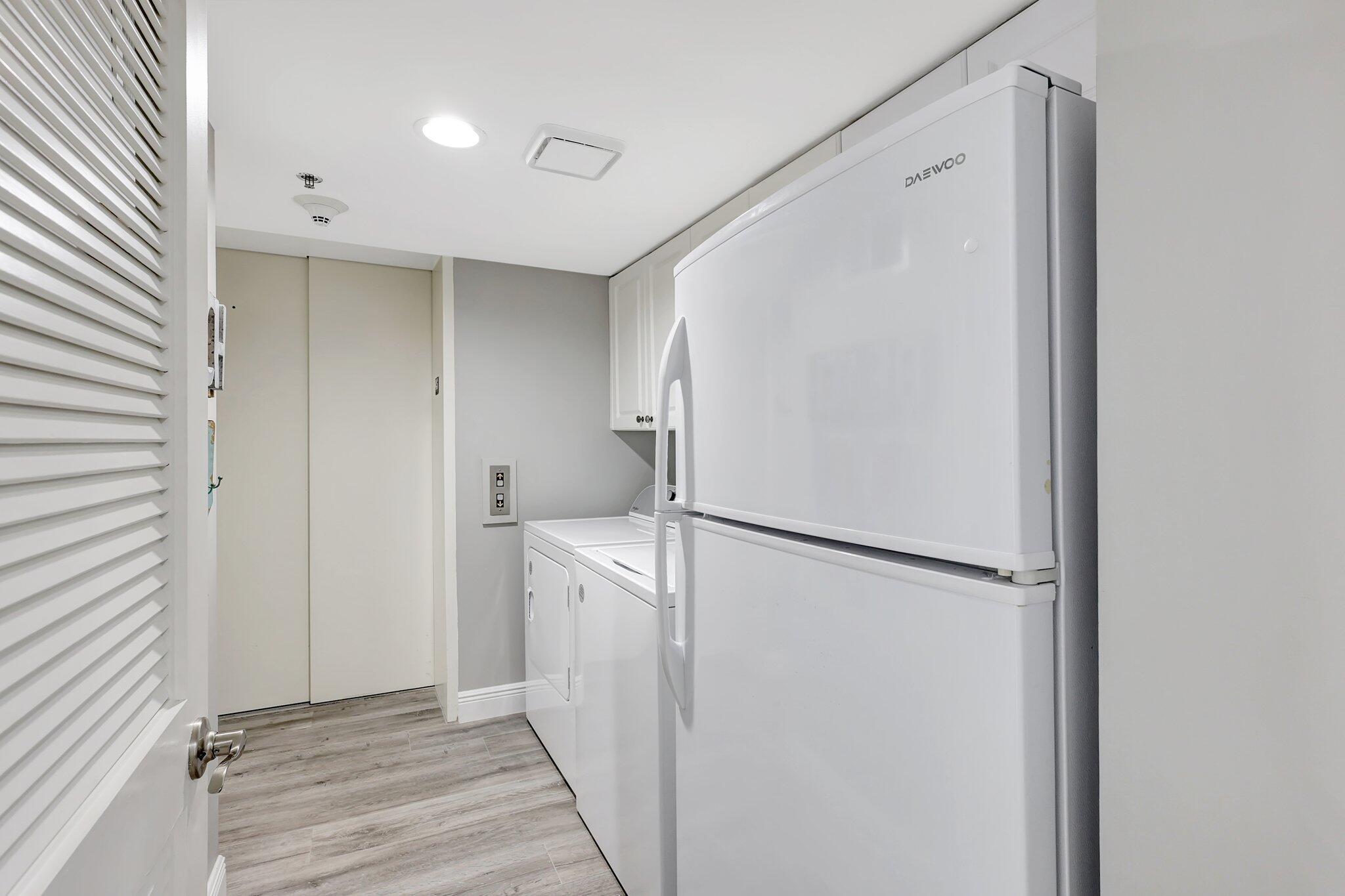 4000 North Hwy A1A, Unit 402 Hutchinson Island, FL 34949 - Photo 40 of 60 a view of a storage & utility room with washer and dryer