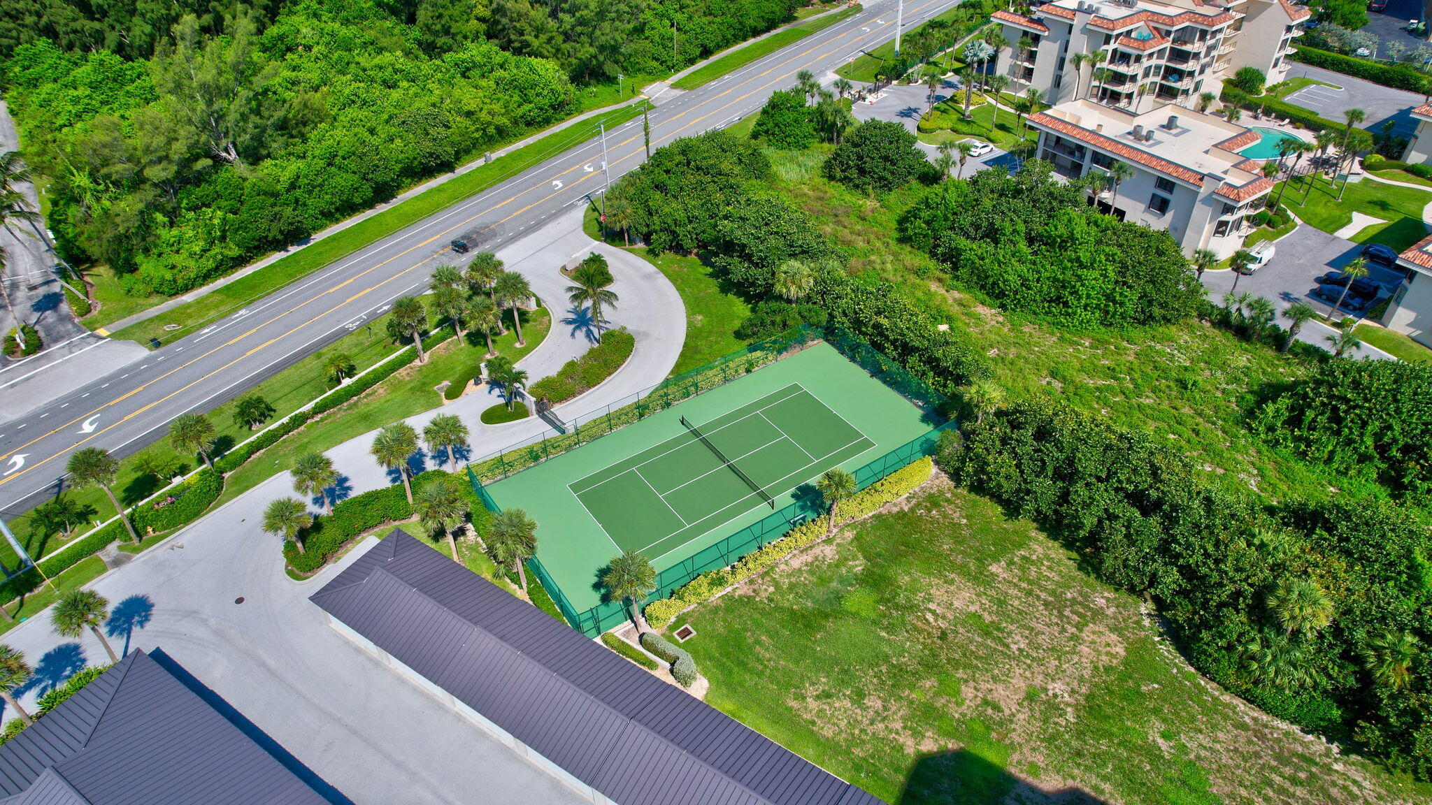 4000 North Hwy A1A, Unit 402 Hutchinson Island, FL 34949 - Photo 56 of 60 a view of a yard with plants