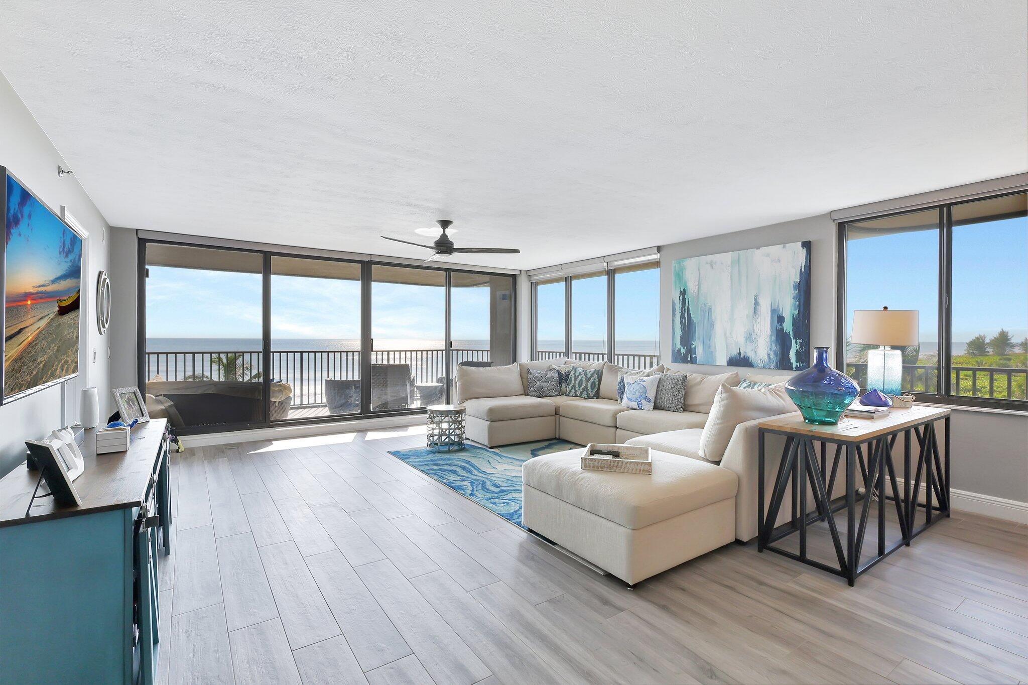 4000 North Hwy A1A, Unit 402 Hutchinson Island, FL 34949 - Photo 7 of 60 a living room with furniture and a large window