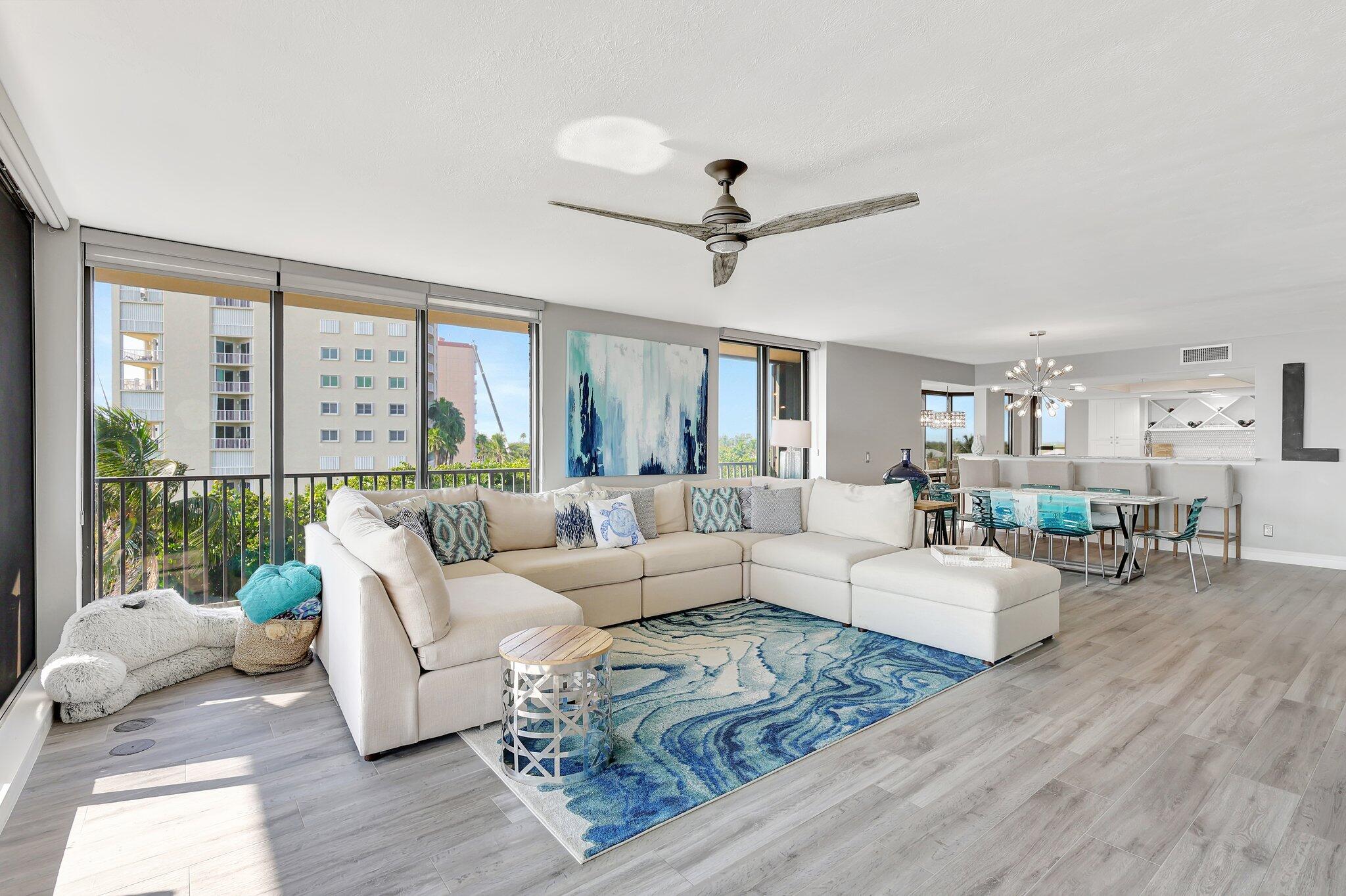 4000 North Hwy A1A, Unit 402 Hutchinson Island, FL 34949 - Photo 8 of 60 a living room with furniture and a large window