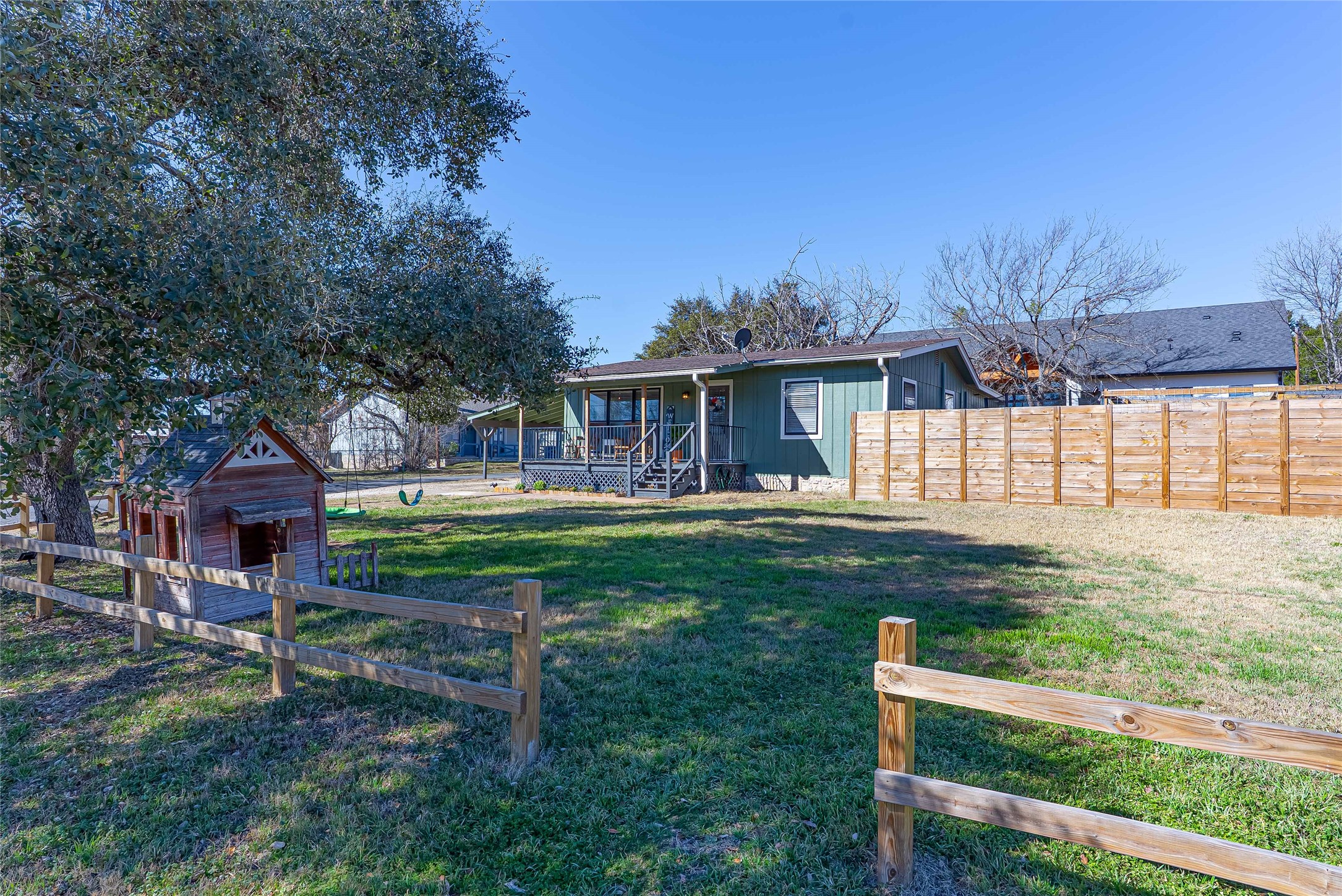 11010 3rd Street Jonestown, TX 78645 - Photo 3 of 23 Welcoming home featuring a large front yard and adorable front porch