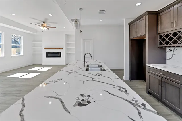 a spacious bathroom with a sink double vanity and a shower