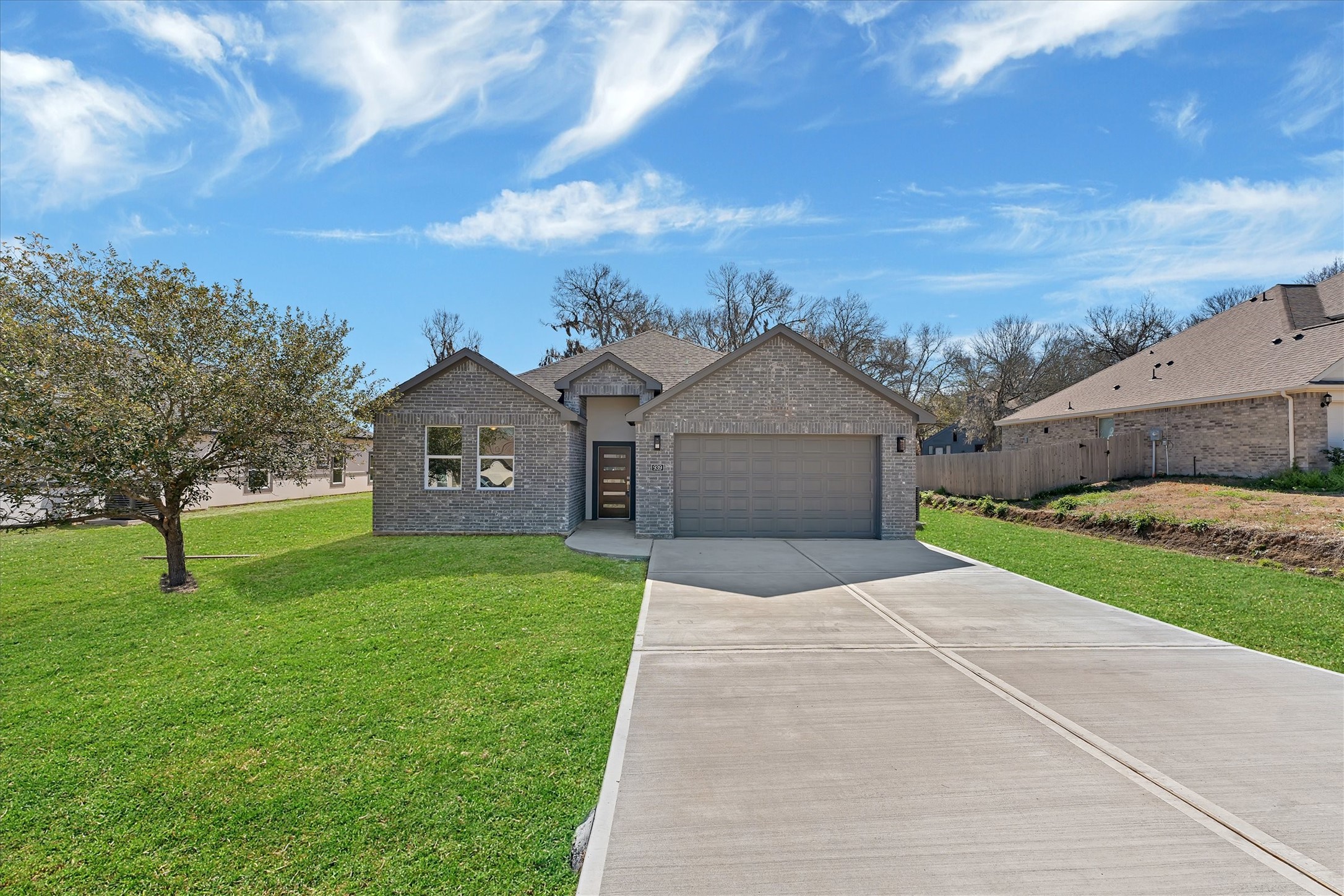 939 Lake View Drive Montgomery, TX 77356 - Photo 2 of 37 a front view of a house with a yard and garage