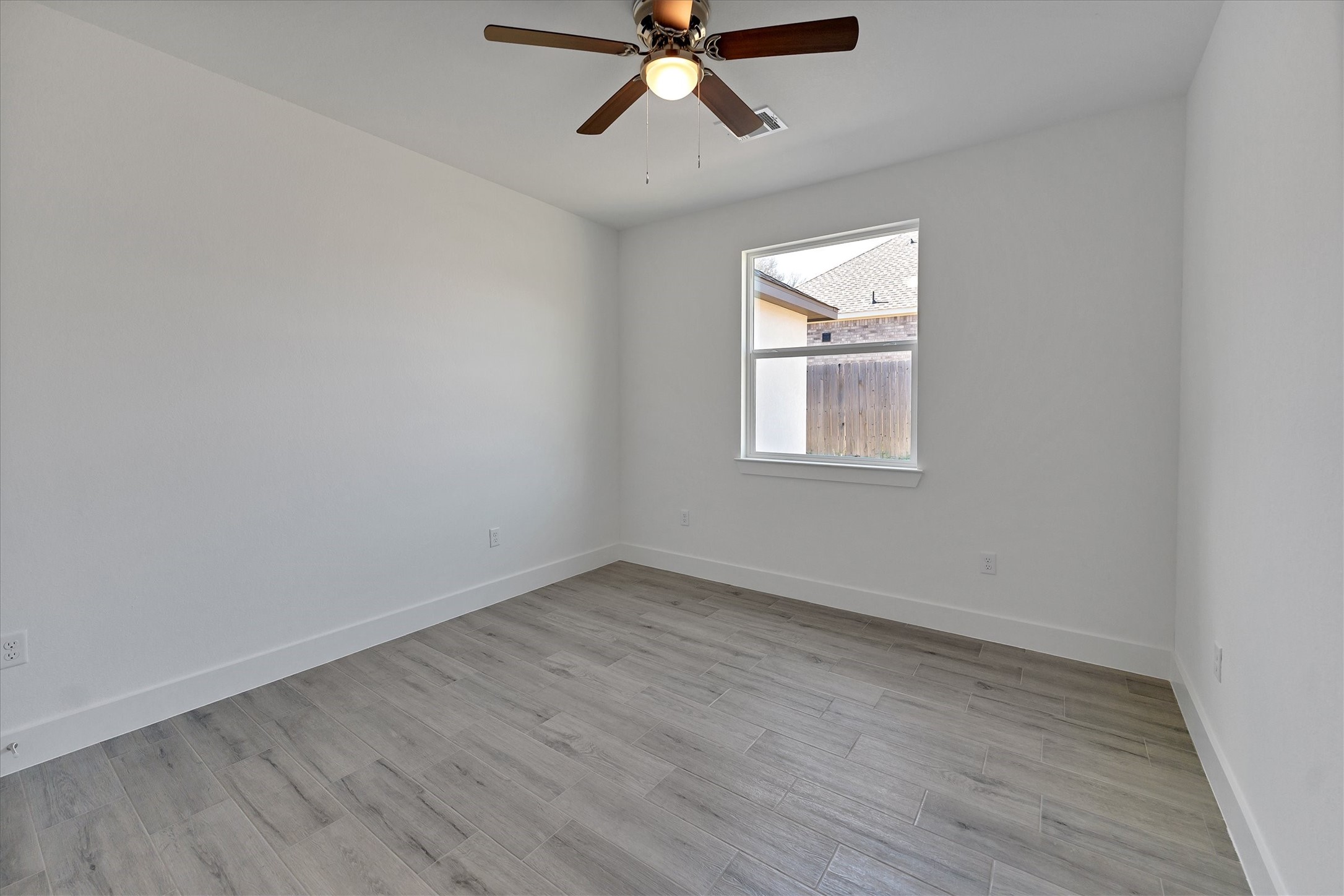 939 Lake View Drive Montgomery, TX 77356 - Photo 23 of 37 wooden floor in an empty room with a window