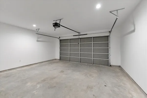 a view of an empty room with a ceiling fan