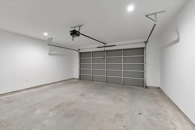 a view of an empty room with a ceiling fan