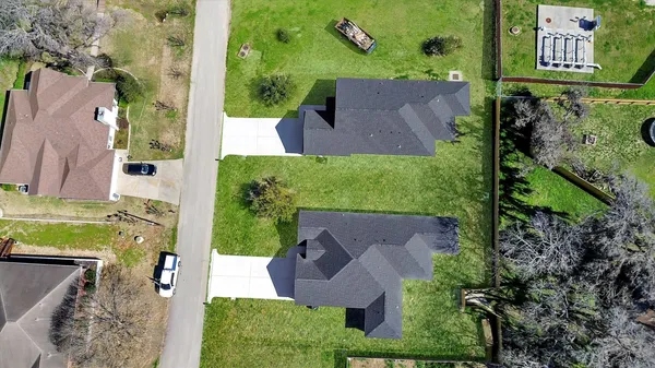 an aerial view of a house with outdoor space and street view