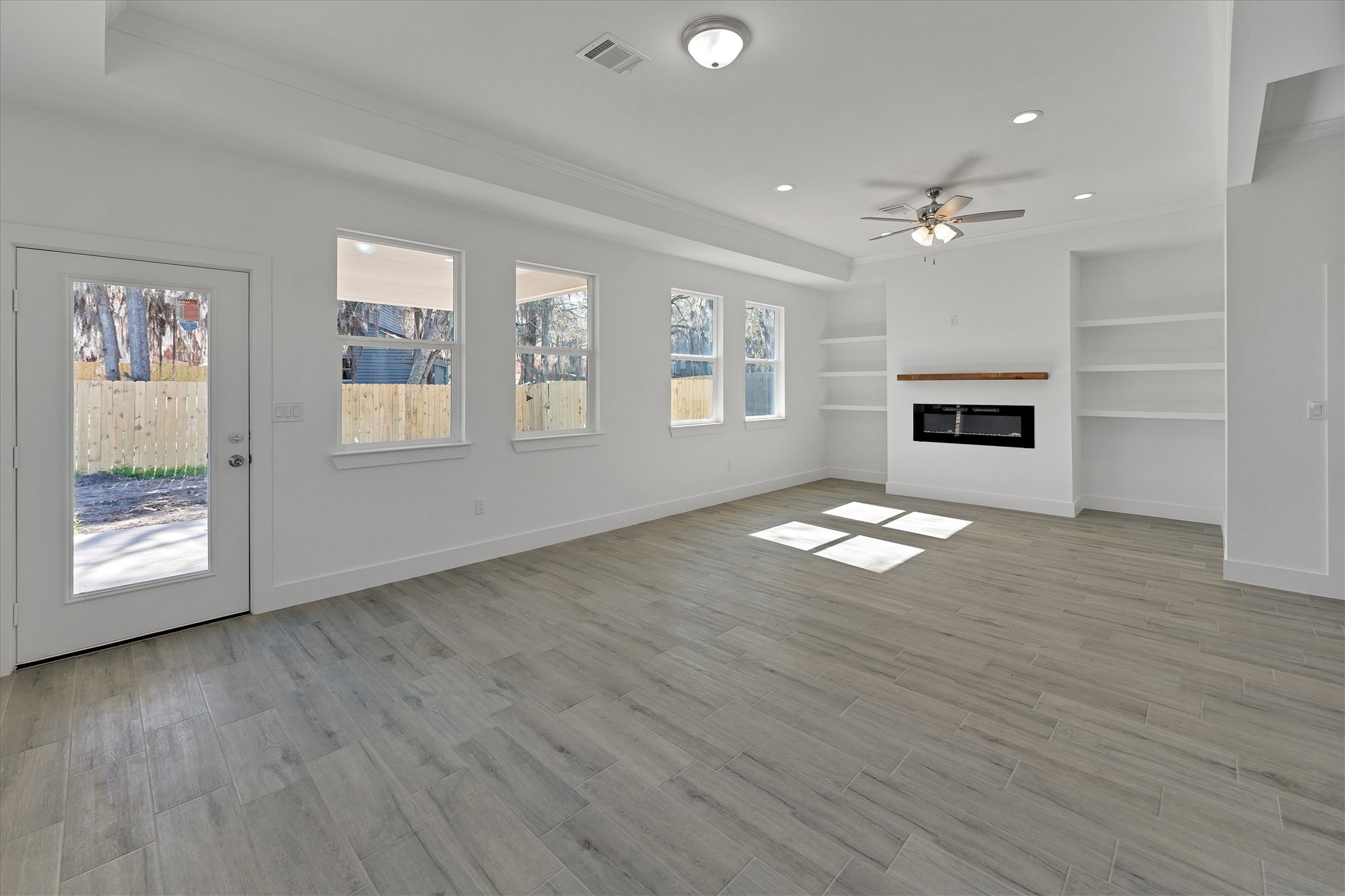 939 Lake View Drive Montgomery, TX 77356 - Photo 6 of 37 a view of empty room with wooden floor and fan