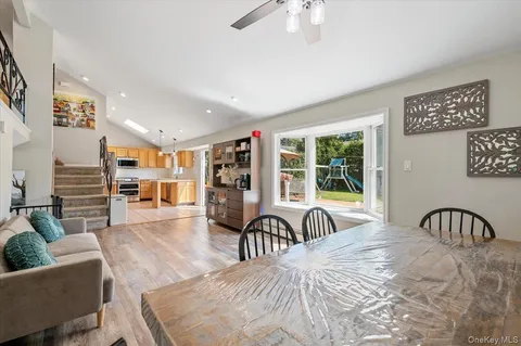 a bedroom with furniture and a large window