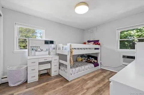 a room with furniture a fireplace and a window