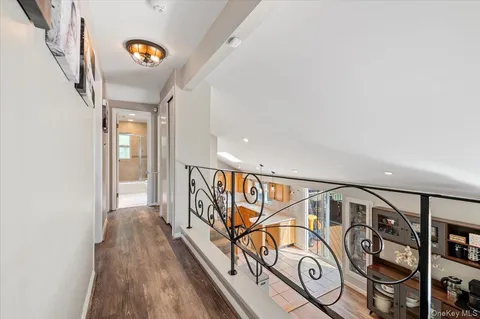 a view of an entryway with wooden floor