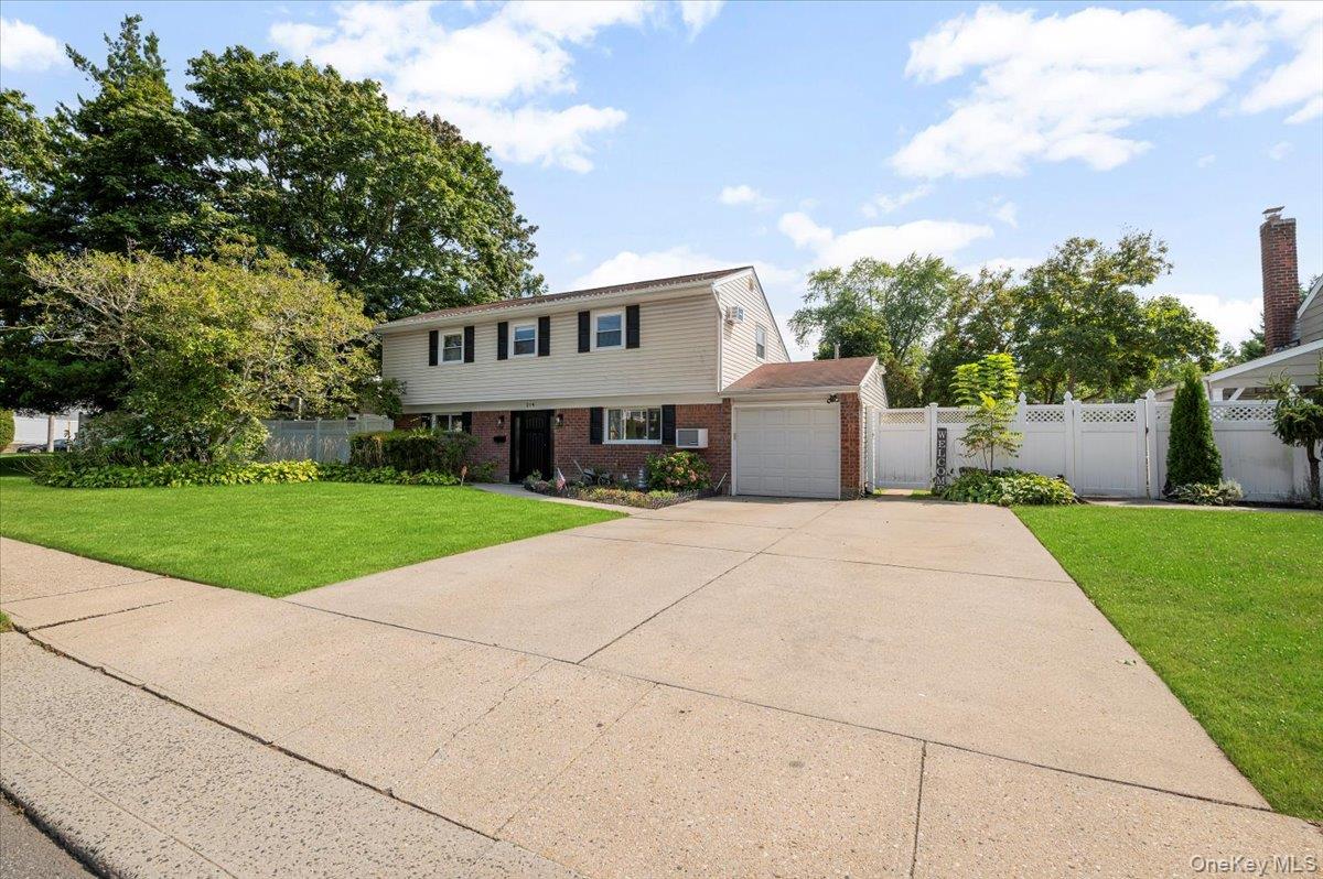 214 Haypath Road Old Bethpage, NY 11804 - Photo 2 of 27 a front view of a house with a yard