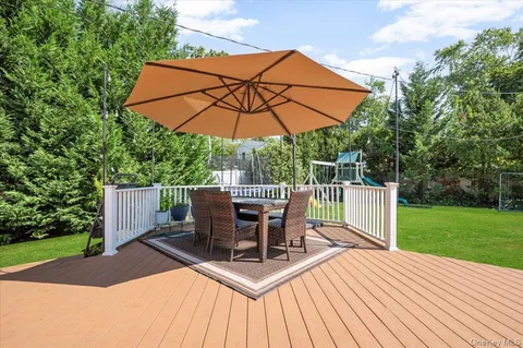 a view of a table and chairs on the deck