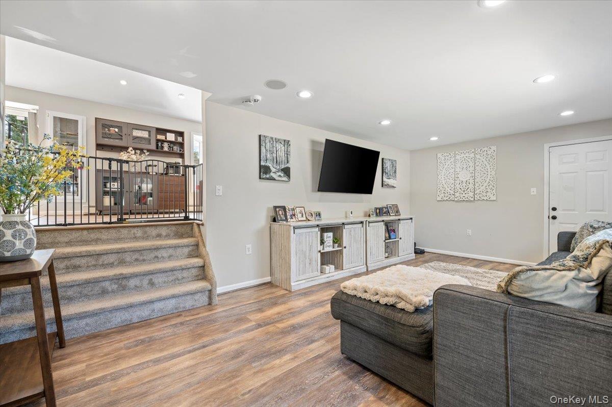 214 Haypath Road Old Bethpage, NY 11804 - Photo 4 of 27 a living room with furniture and a flat screen tv