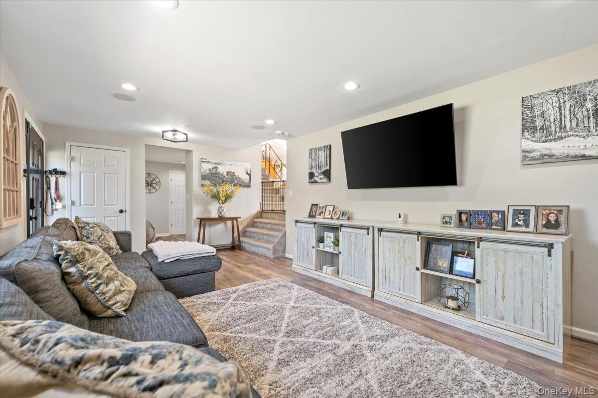 214 Haypath Road Old Bethpage, NY 11804 - Photo 5 of 27 a living room with furniture and a flat screen tv