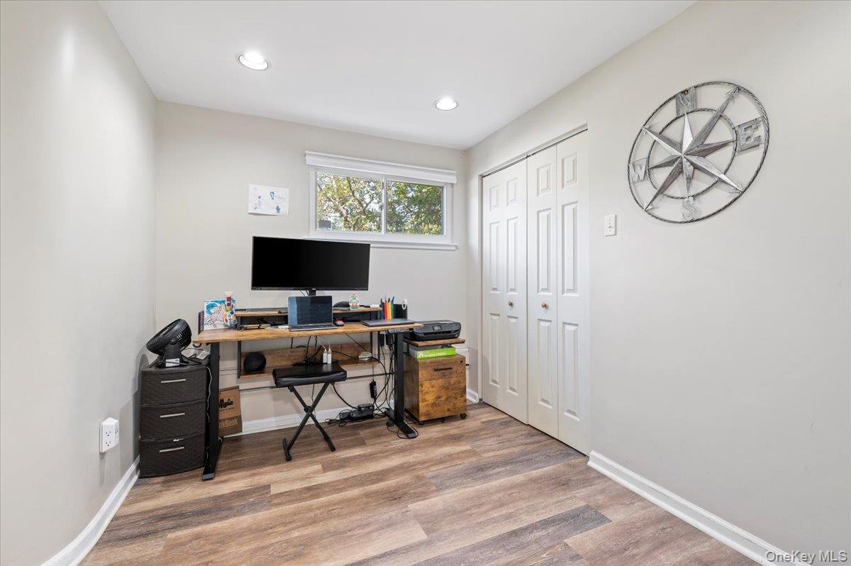 214 Haypath Road Old Bethpage, NY 11804 - Photo 6 of 27 a view of a workspace with furniture and a window