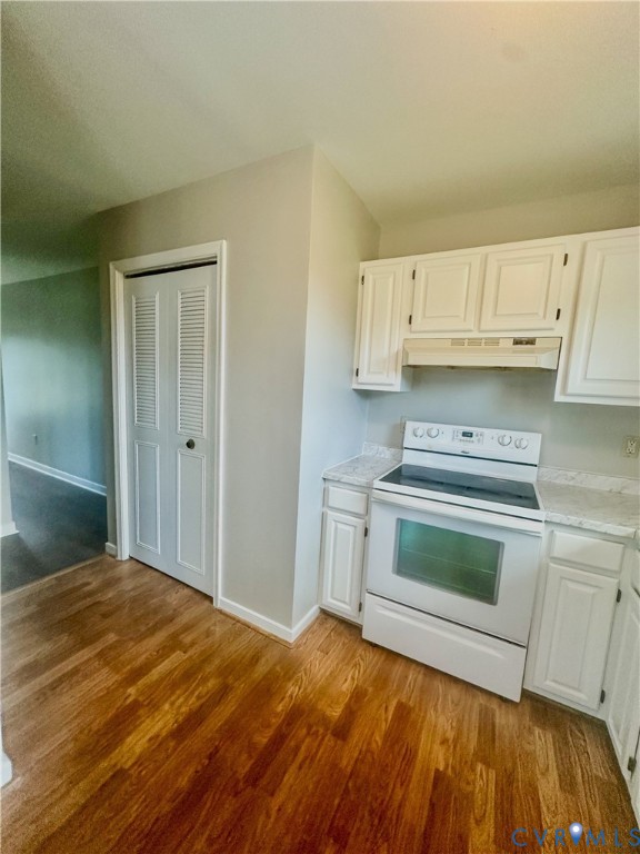 7530 South Genito Road Jetersville, VA 23083 - Photo 8 of 16 Kitchen featuring wood-finish flooring, white cabi