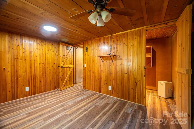 a view of a room with wooden walls