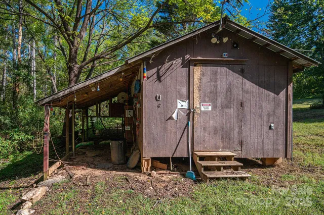 a backyard of a house with seating space and trees