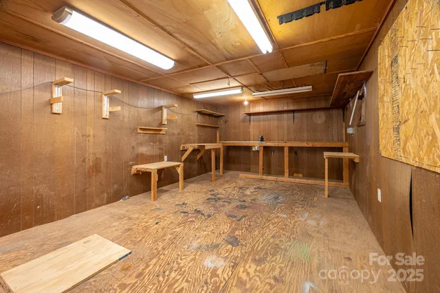 a view of an empty room with wooden walls