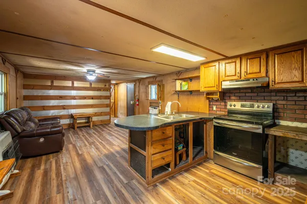 a kitchen with a stove and a refrigerator