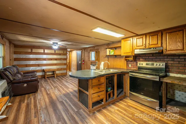 a kitchen with a stove and a refrigerator