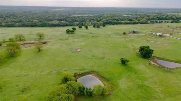a view of a lake with a yard