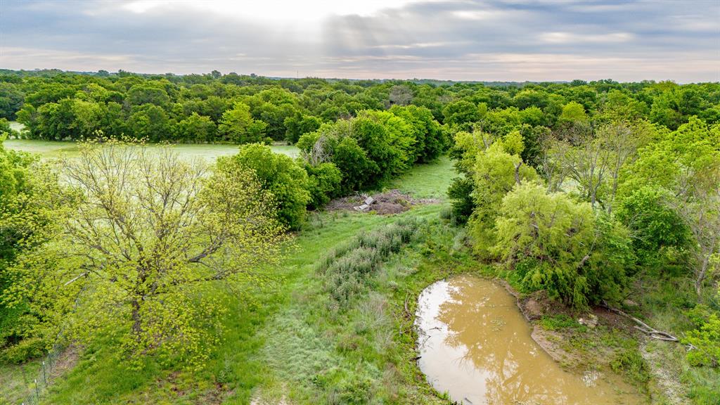 3061 Turkey Creek Road Sunset, TX 76270 - Photo 12 of 38 a view of a lake view with a garden