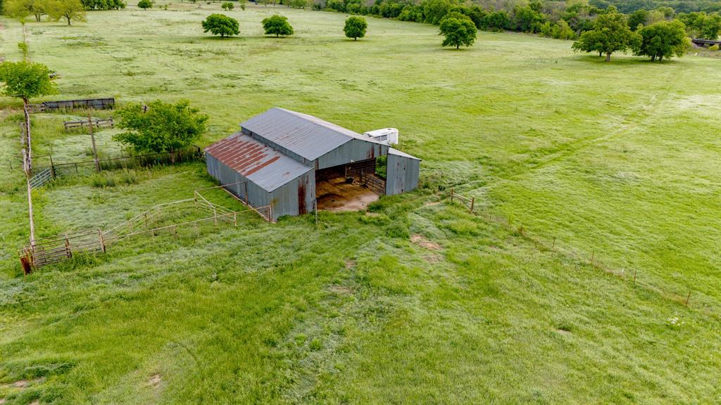 3061 Turkey Creek Road Sunset, TX 76270 - Photo 13 of 38 a view of a yard with an outdoor seating