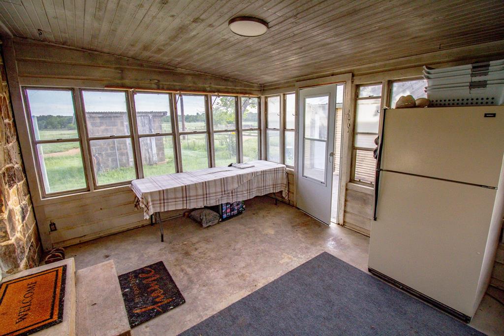 3061 Turkey Creek Road Sunset, TX 76270 - Photo 18 of 38 a room with a bed and a window