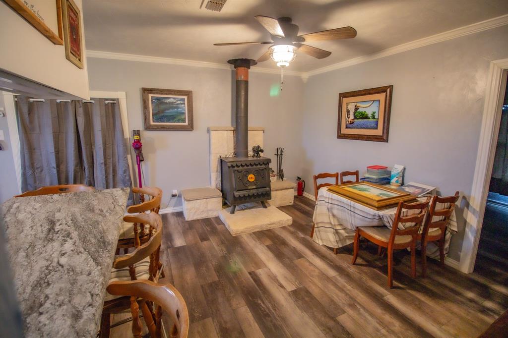 3061 Turkey Creek Road Sunset, TX 76270 - Photo 20 of 38 a living room with furniture a piano and a chandelier