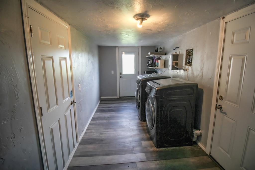 3061 Turkey Creek Road Sunset, TX 76270 - Photo 29 of 38 a view of a hallway with wooden floor and staircase