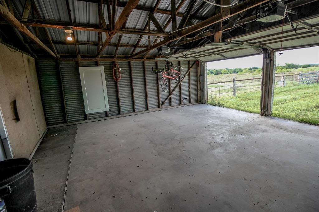 3061 Turkey Creek Road Sunset, TX 76270 - Photo 30 of 38 a view of an empty room with a fireplace