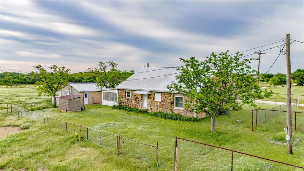 3061 Turkey Creek Road Sunset, TX 76270 - Photo 34 of 38 a house view with a garden space