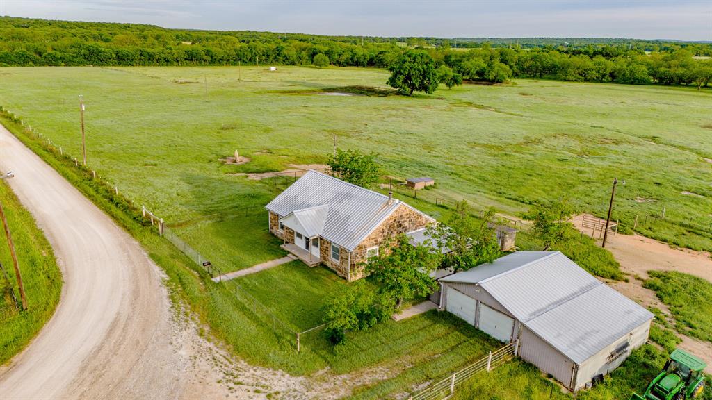 3061 Turkey Creek Road Sunset, TX 76270 - Photo 4 of 38 an aerial view of a house with outdoor space swimming pool and mountains