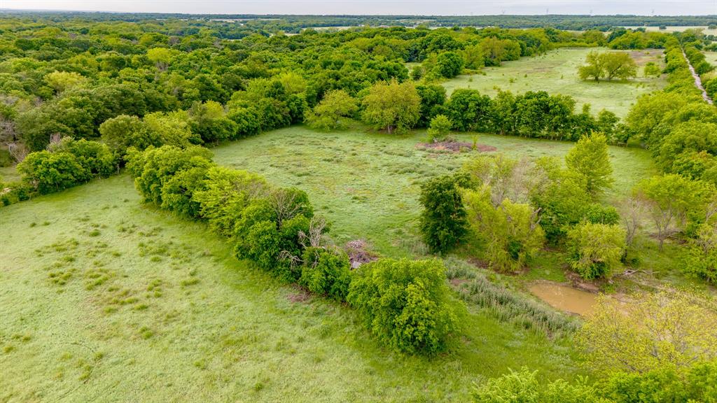 3061 Turkey Creek Road Sunset, TX 76270 - Photo 9 of 38 a view of a garden with a building
