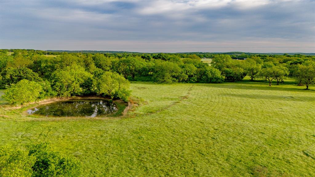 3061 Turkey Creek Road Sunset, TX 76270 - Photo 10 of 38 a view of a yard with an outdoor space
