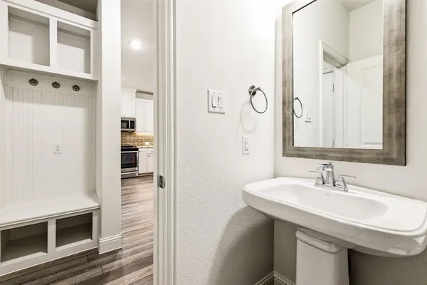 a bathroom with a sink and a mirror