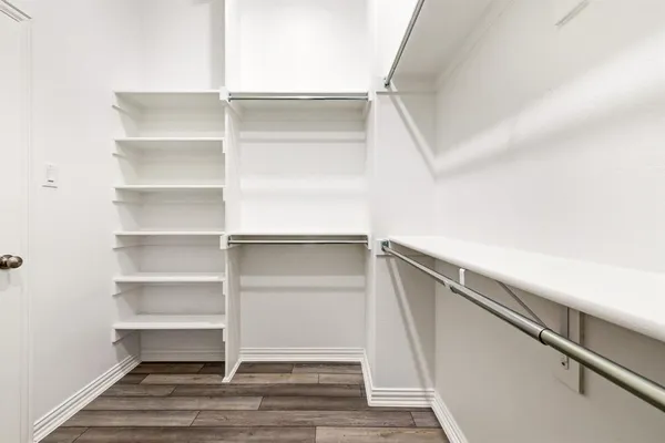 a view of an empty walk in closet