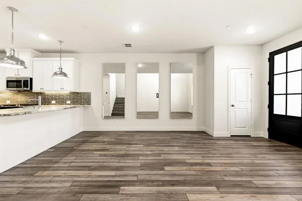 a view of kitchen with wooden floor