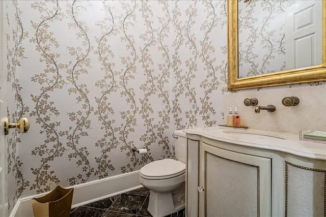 a bathroom with a toilet and sink