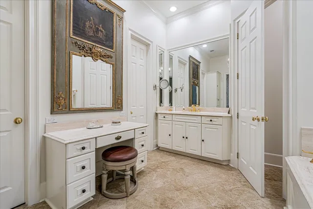 a bathroom with a granite countertop toilet sink and mirror